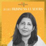 A woman standing in front of the words indiaspora 2 0 2 0 business leaders.