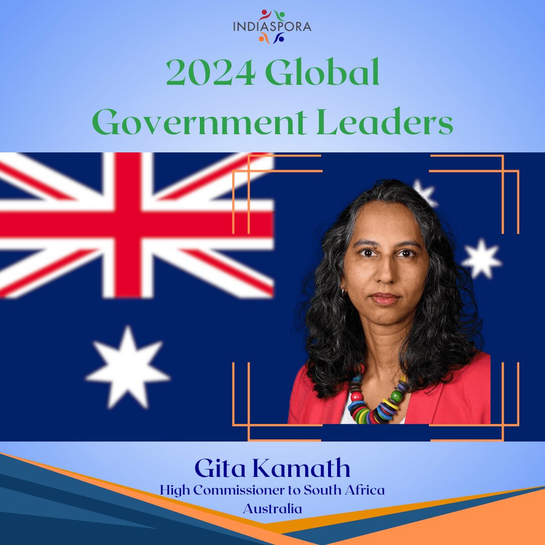 A woman standing in front of an australian flag.