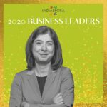 A woman standing in front of the words indiaspora 2 0 2 0 business leaders.