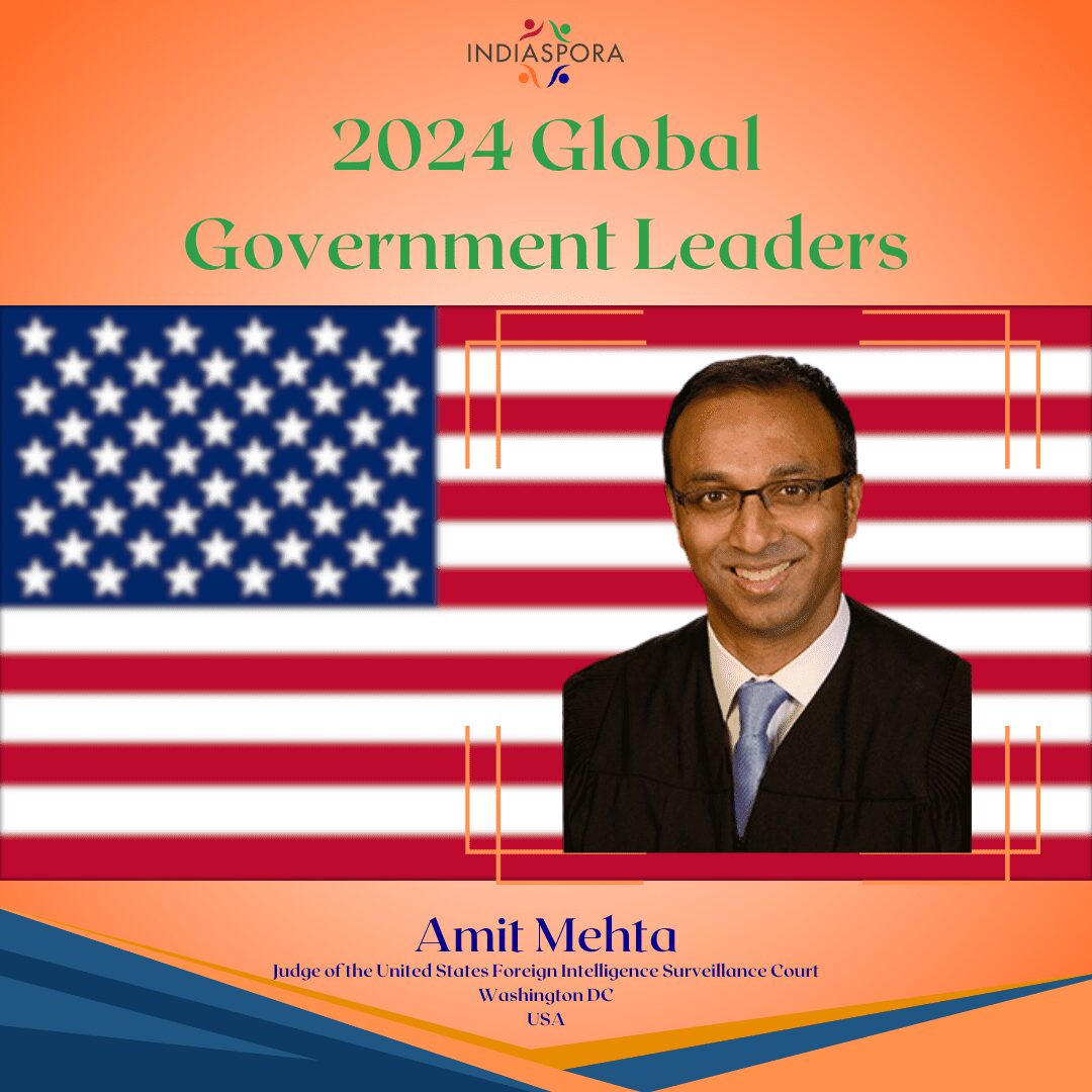 A picture of amit mehta with the american flag behind him.