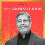 A man in suit and tie standing next to the words indiaspora 2 0 2 0 business leaders.