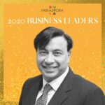 A man in suit and tie standing next to the words indiaspora 2 0 2 0 business leaders.