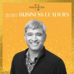 A man standing in front of the words indiaspora 2 0 2 0 business leaders.