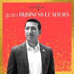 A man standing in front of the words indiaspora 2 0 2 0 business leaders.