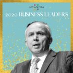 A man in suit and tie standing next to the words indiaspora 2 0 2 0 business leaders.