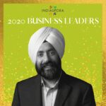 A man with a turban is smiling for the camera.