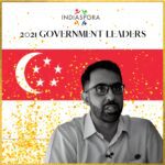 A man in glasses and a flag of singapore