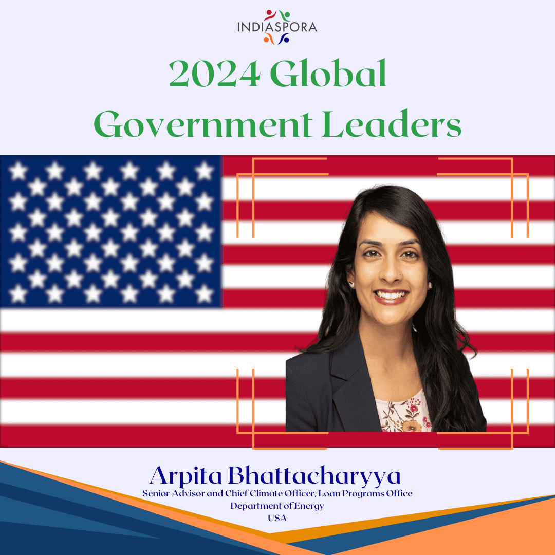 A picture of arpita bhattacharyya with the american flag behind her.