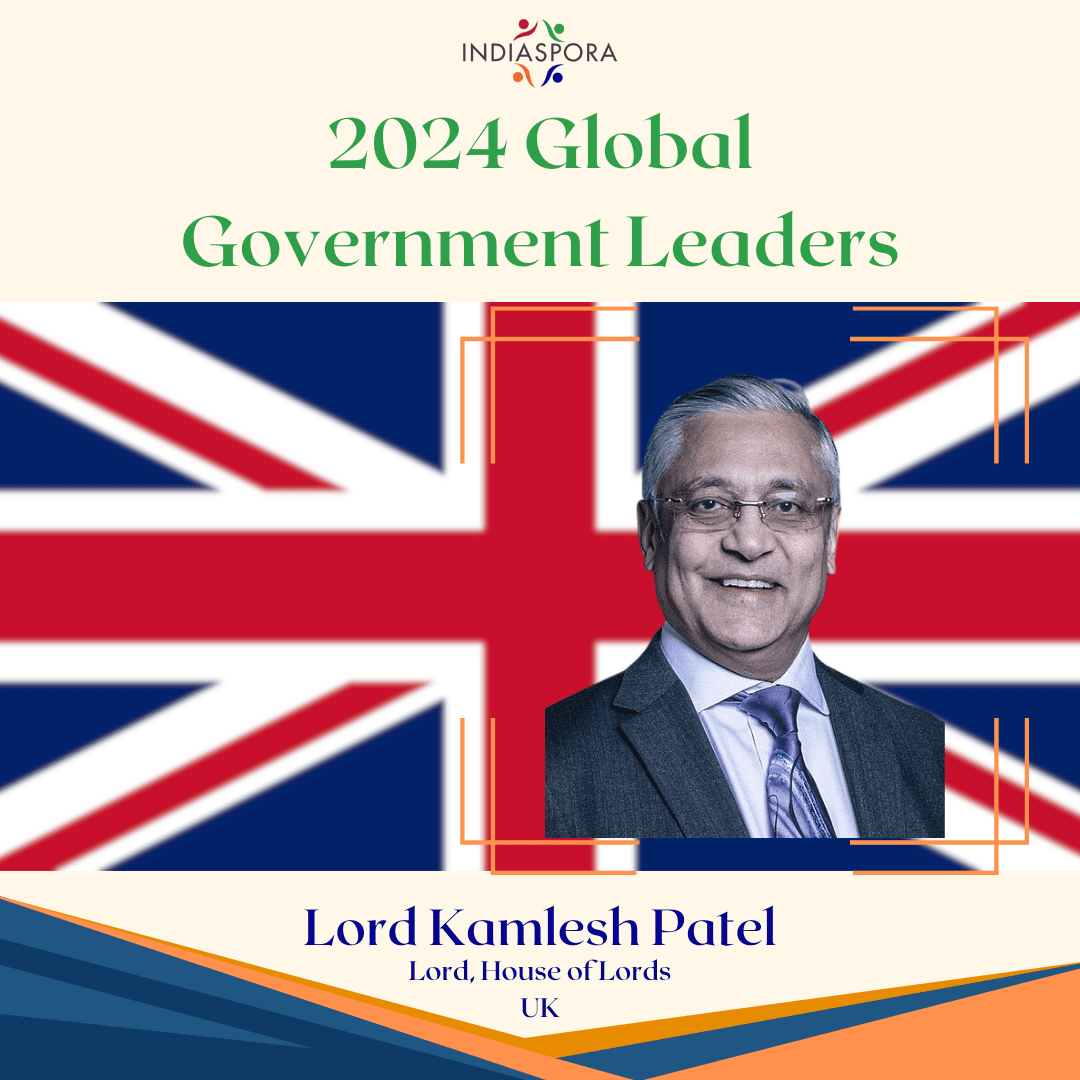A picture of lord kunlesh patel with the british flag behind him.