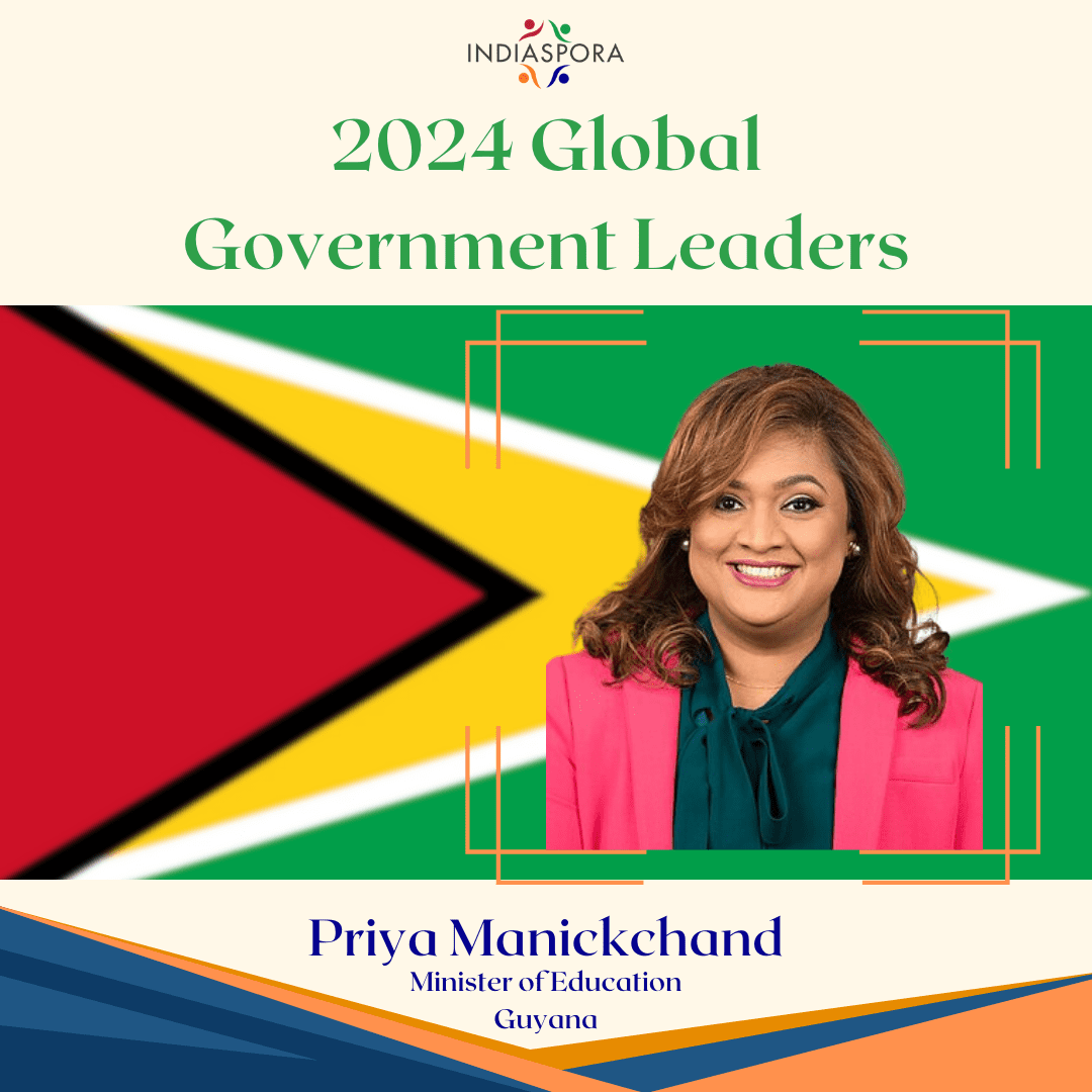 A woman standing in front of the flag of guyana.