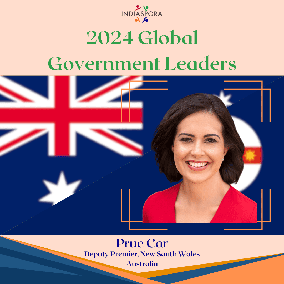 A woman in front of an australian flag.