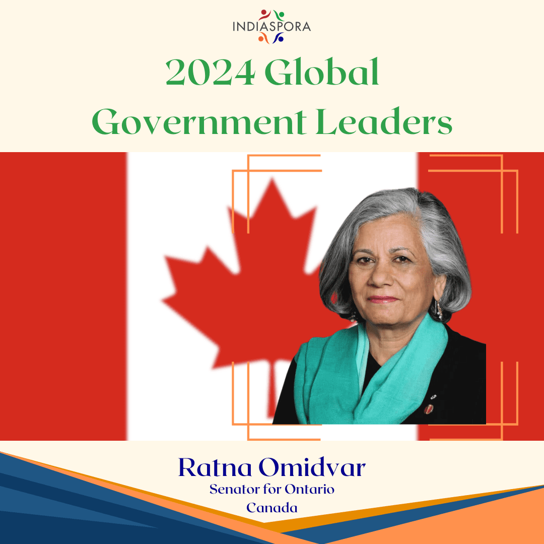 A picture of ratna omidvar with the canadian flag in background.|A woman with gray hair wearing green and black.