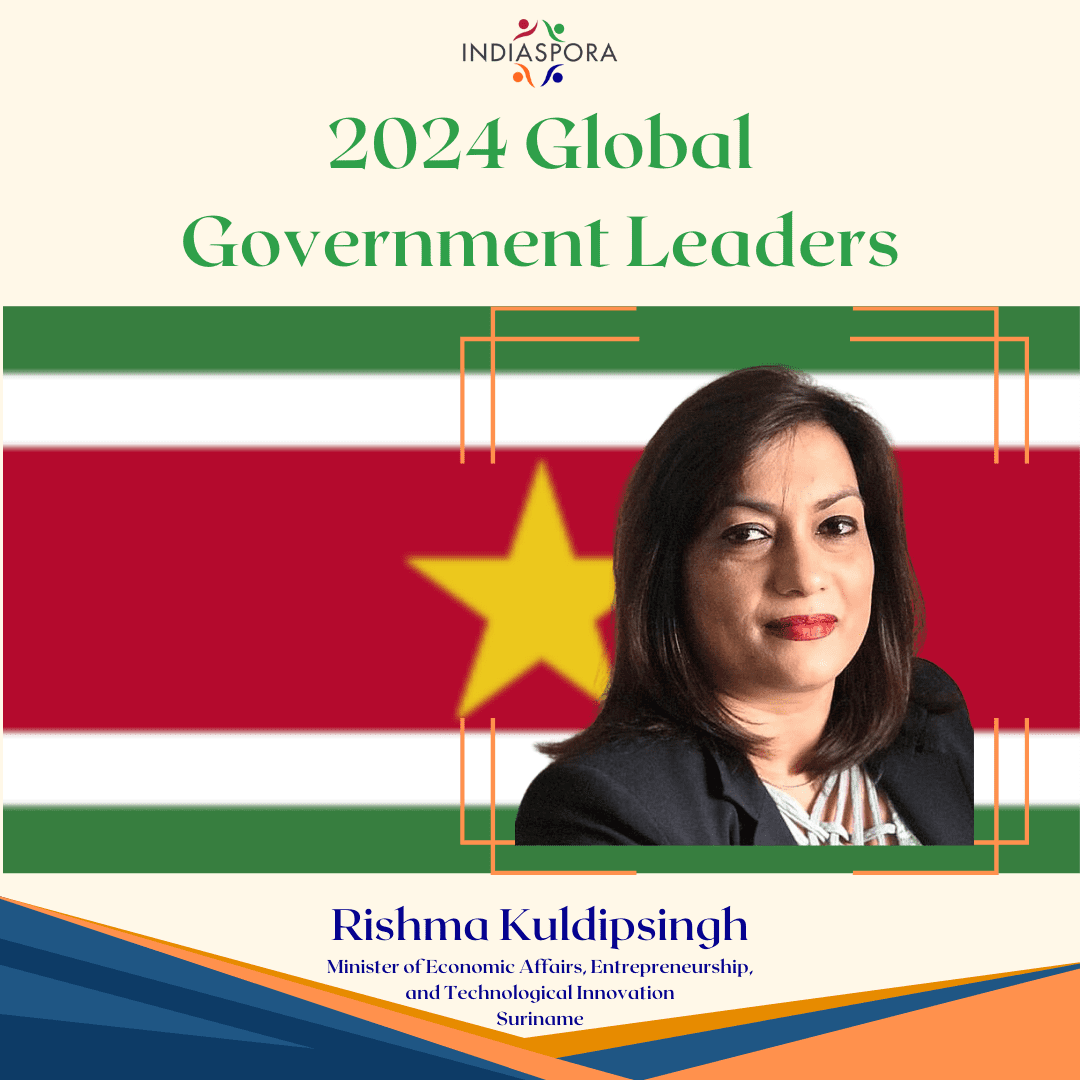 A woman in front of the flag of suriname.