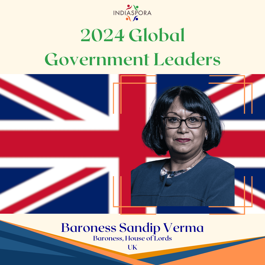 A picture of baroness verma with the british flag behind her.