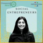 A woman is smiling for the camera with social entrepreneurs logo in front of her.