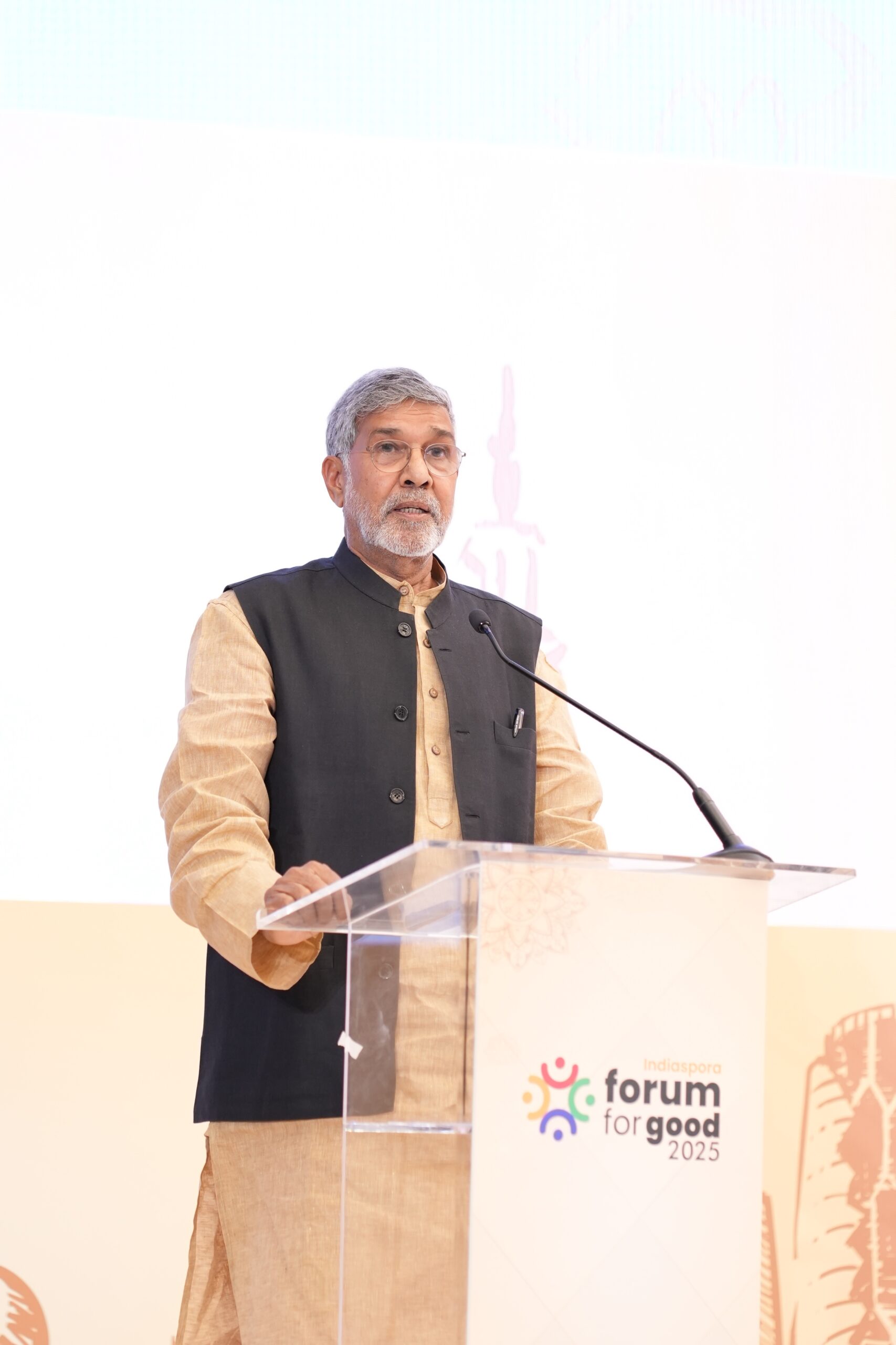 A man standing at a podium with a microphone.