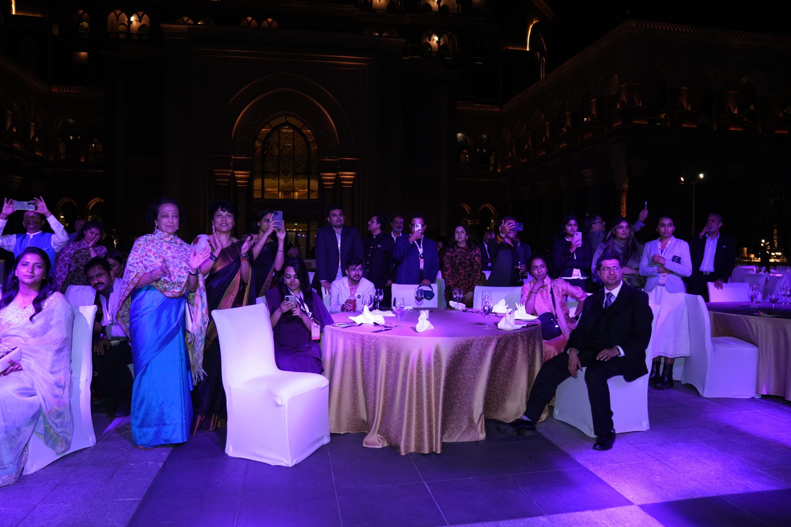 A group of people sitting around a table.