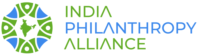 A black background with the words india philanthropy alliance written in blue and green.|A poster with a girl holding a pencil