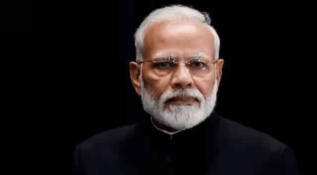 A picture of narendra modi taken in the dark.