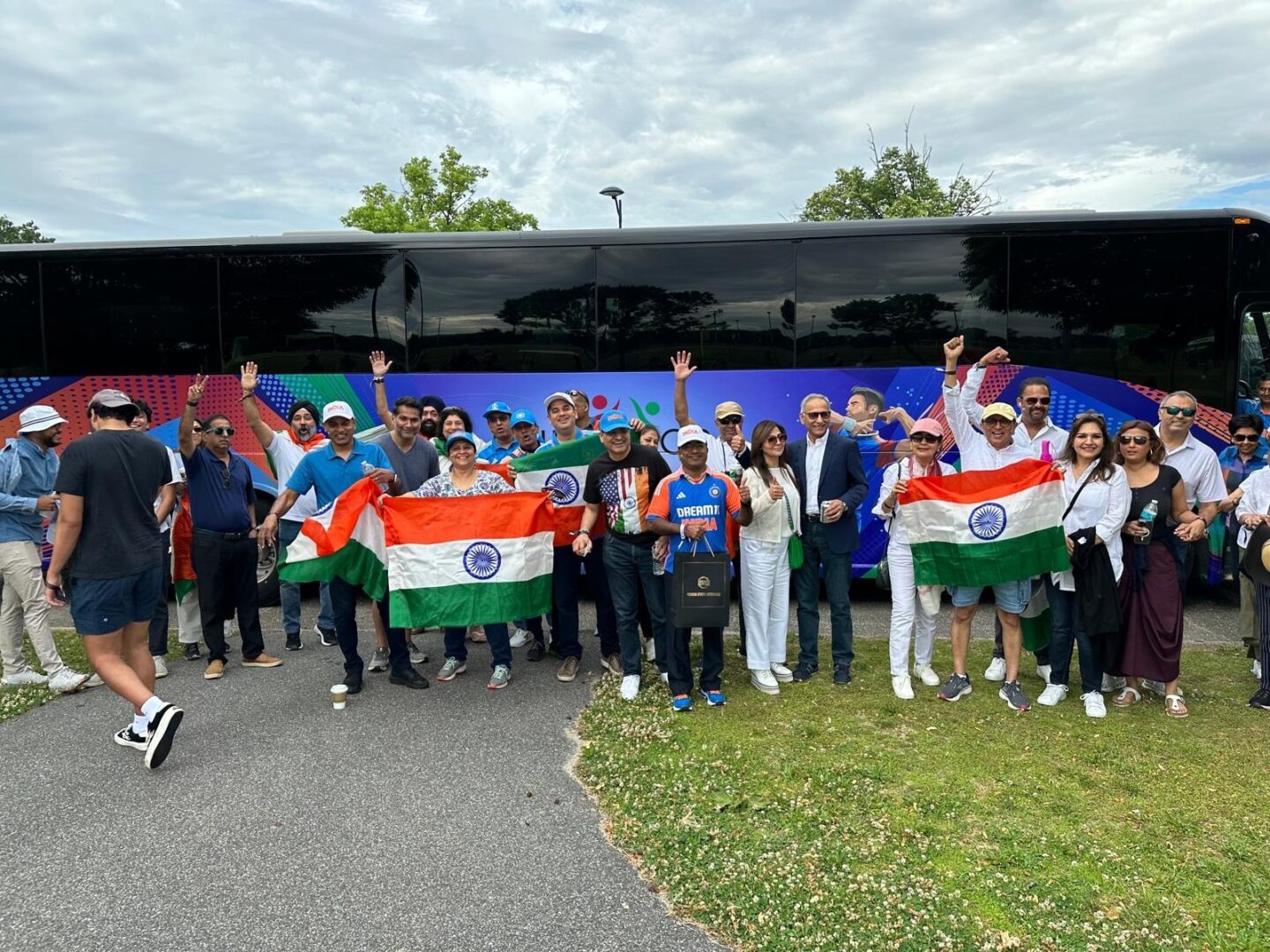 A group of people standing next to each other holding flags.|A baseball player is throwing the ball to another player.|A group of people standing next to each other holding flags.|A group of men holding onto a trophy