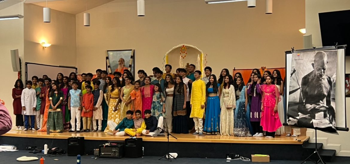 A group of people standing on top of a stage.