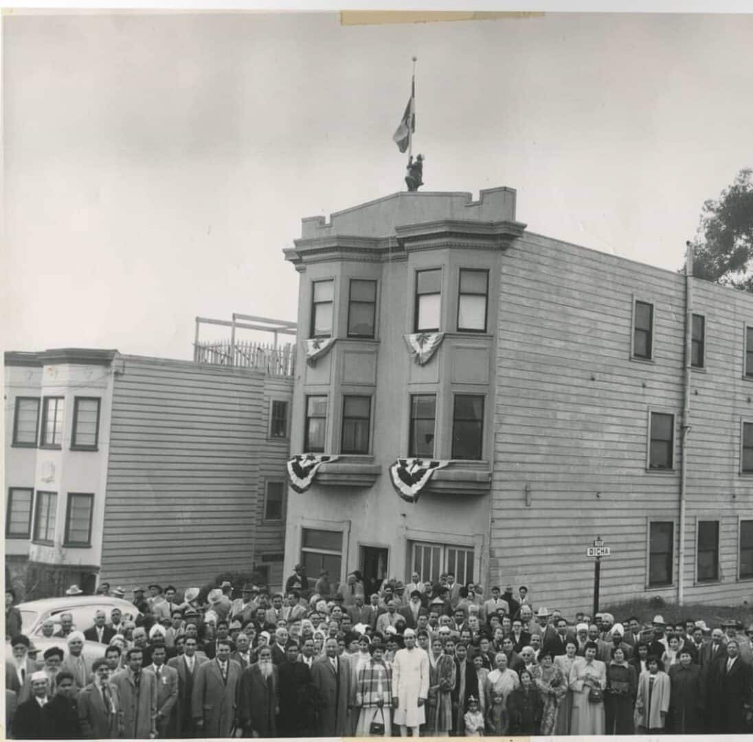 Large crowd outside decorated three-story residential building|Close-up portrait of woman with brown hair|Vintage San Francisco Chronicle front page newspaper|Historic newspaper montage about courtroom murder case|Vintage newspaper page with portraits and headline|Historic San Francisco Chronicle front page