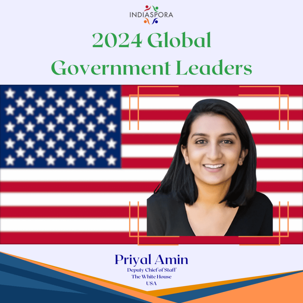 A picture of priyal amin with the american flag behind her.