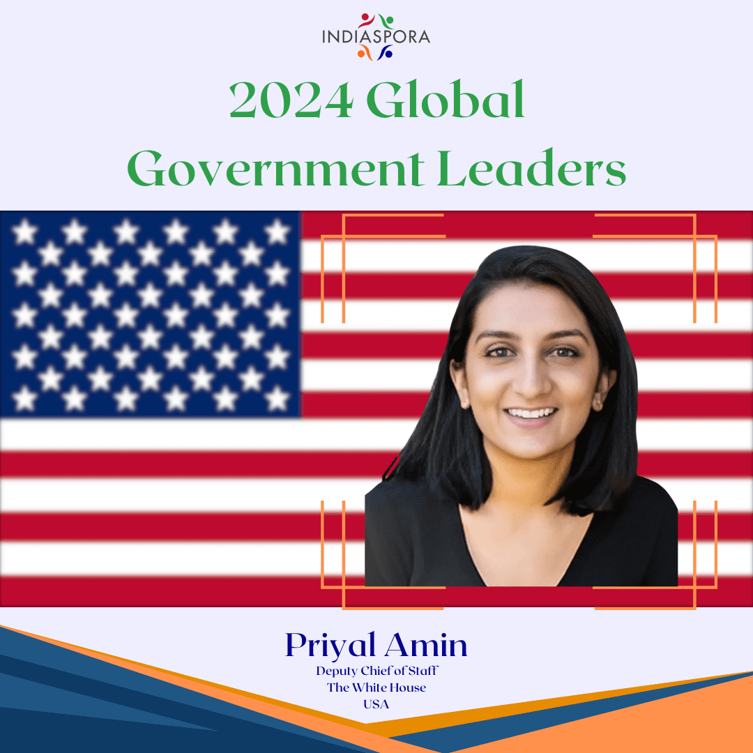 A picture of priyal amin with the american flag behind her.