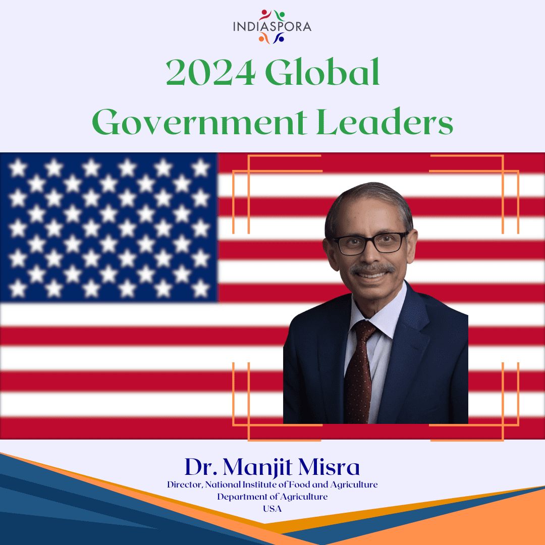 A picture of dr. Monji misra with the american flag behind him