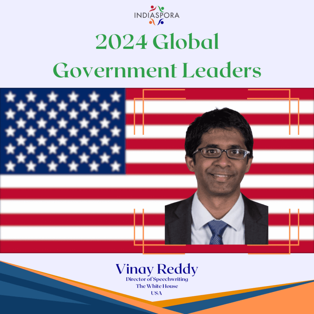 A man in glasses and an american flag.