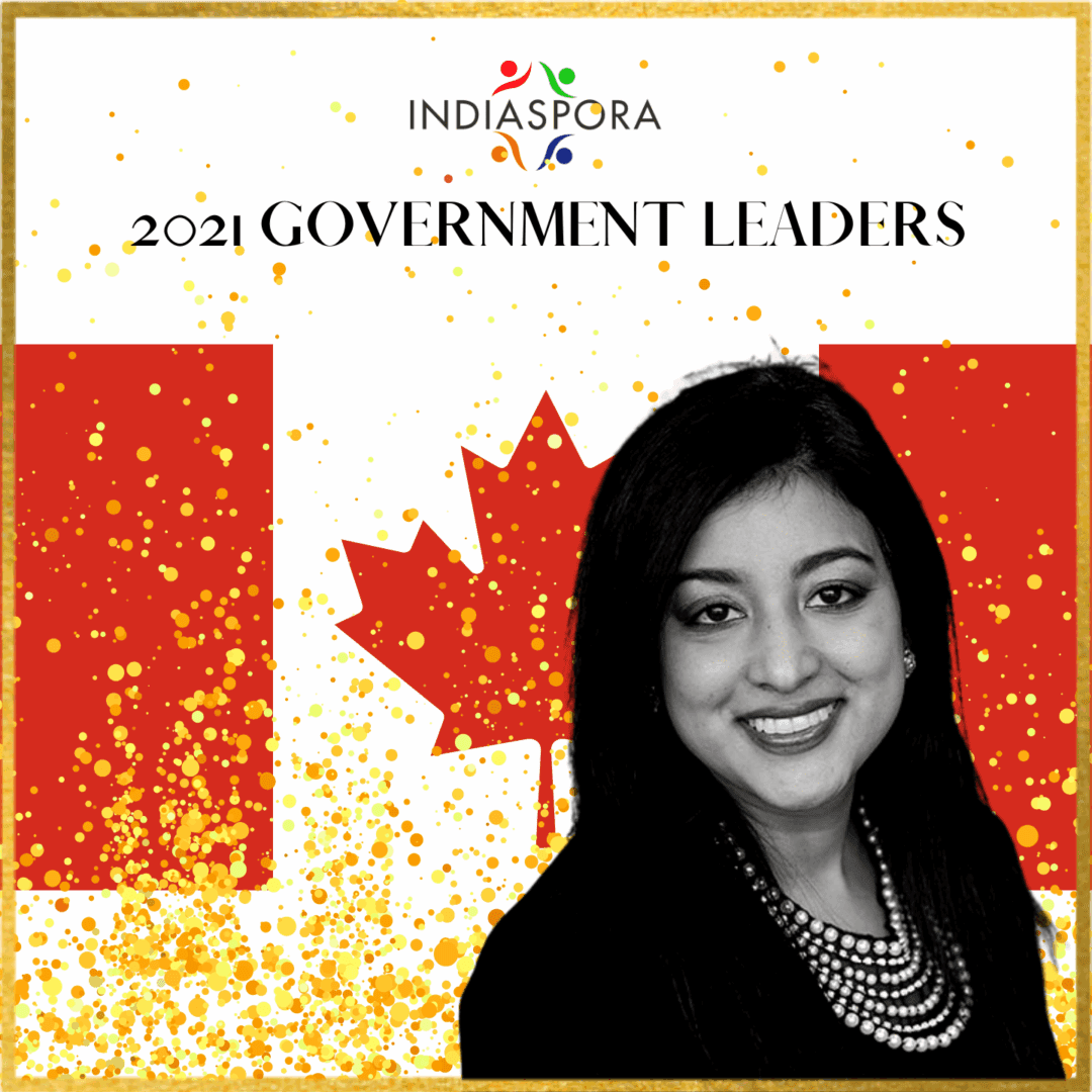A woman in black shirt and necklace with canadian flag.
