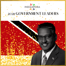 A man in suit and tie standing next to the words " indiaspora 2 0 2 1 government leaders ".