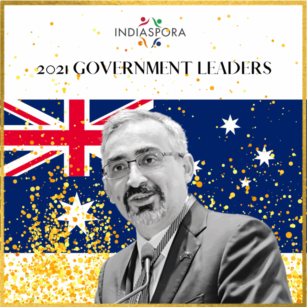 A picture of a person with the australian flag in the background.|A picture of a person with the australian flag in the background.