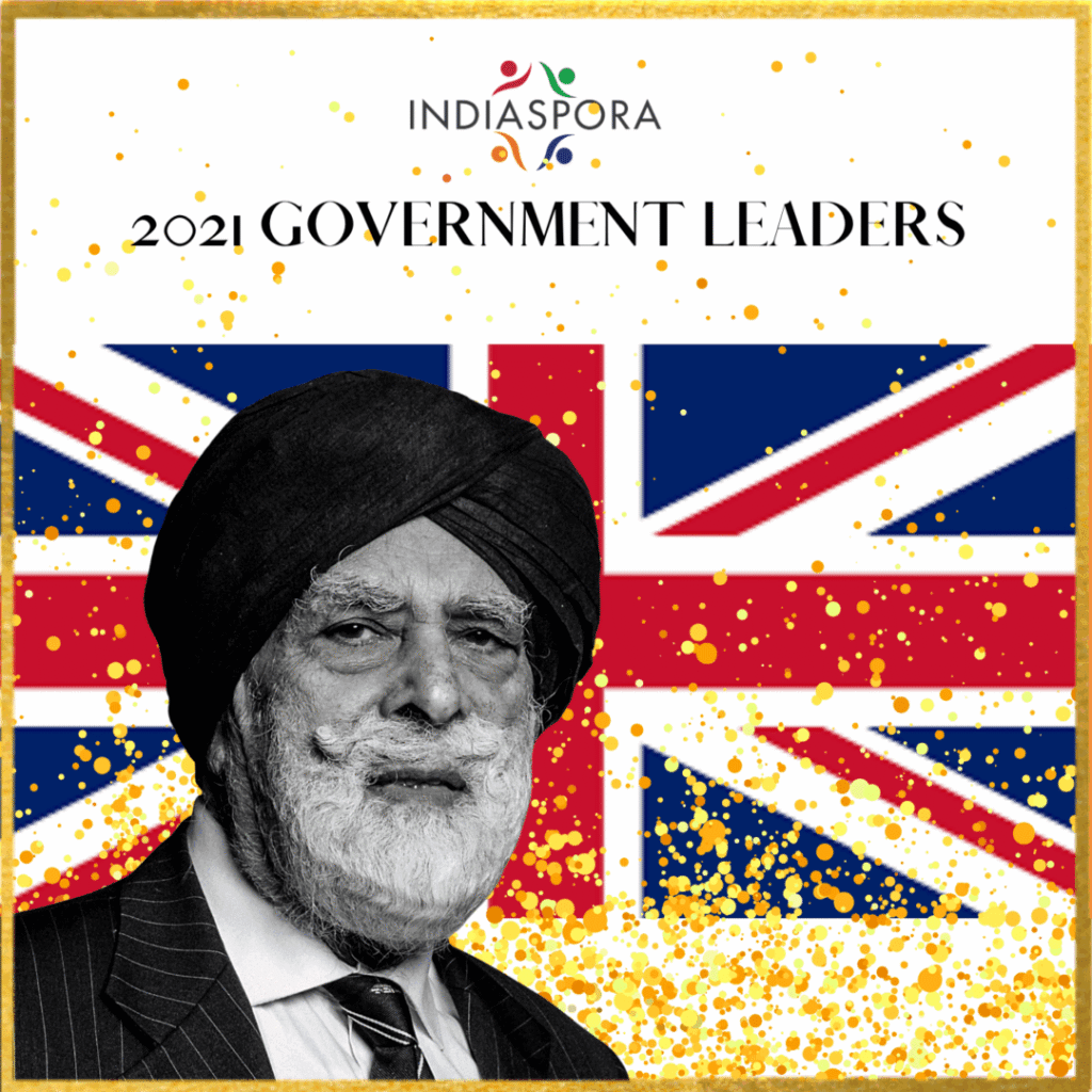 A man with a turban and glasses on.