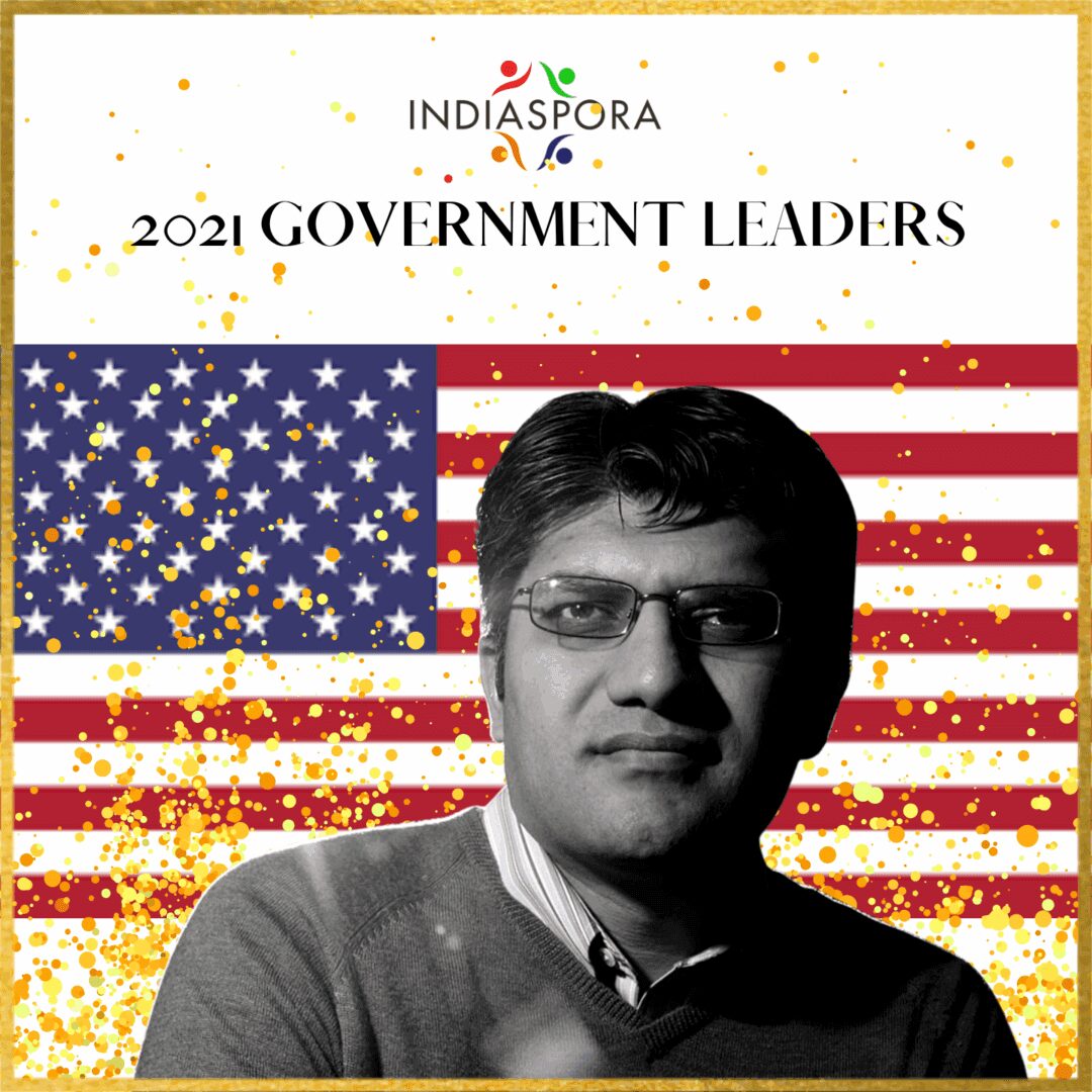 A man in glasses and an american flag