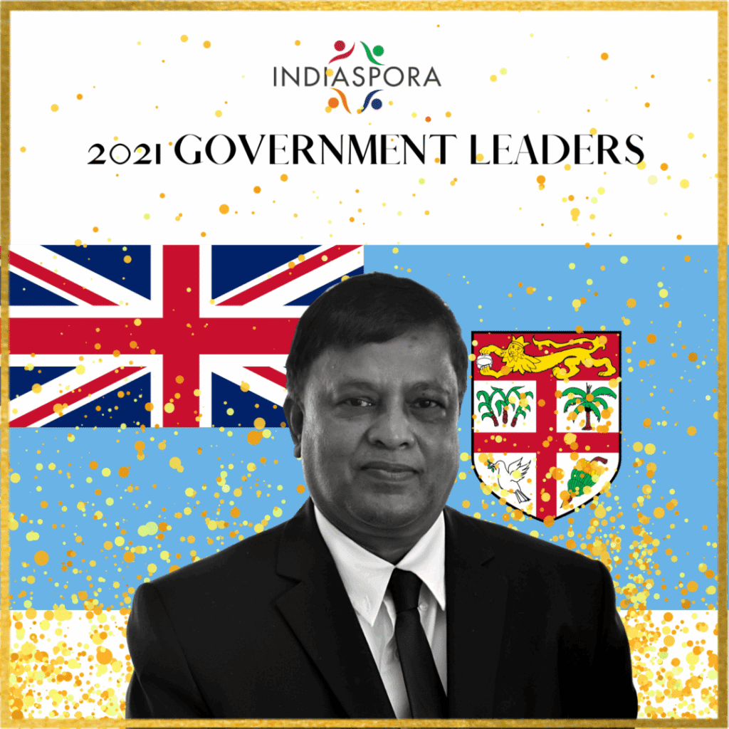 A man in suit and tie with flag background|A man in suit and tie with flag background