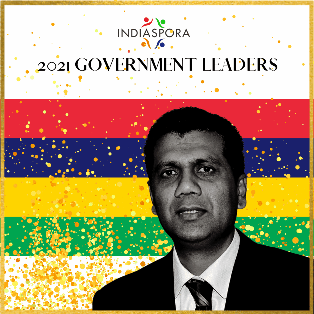 A man in suit and tie standing next to the words " government leaders ".
