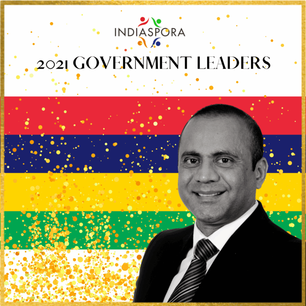 A man in suit and tie standing next to the words " government leaders ".