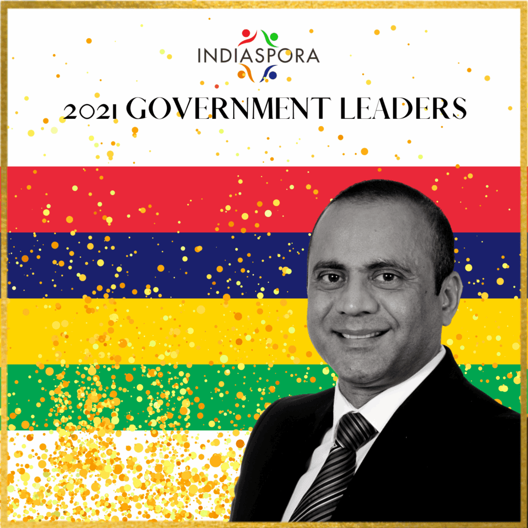 A man in suit and tie standing next to the words " government leaders ".