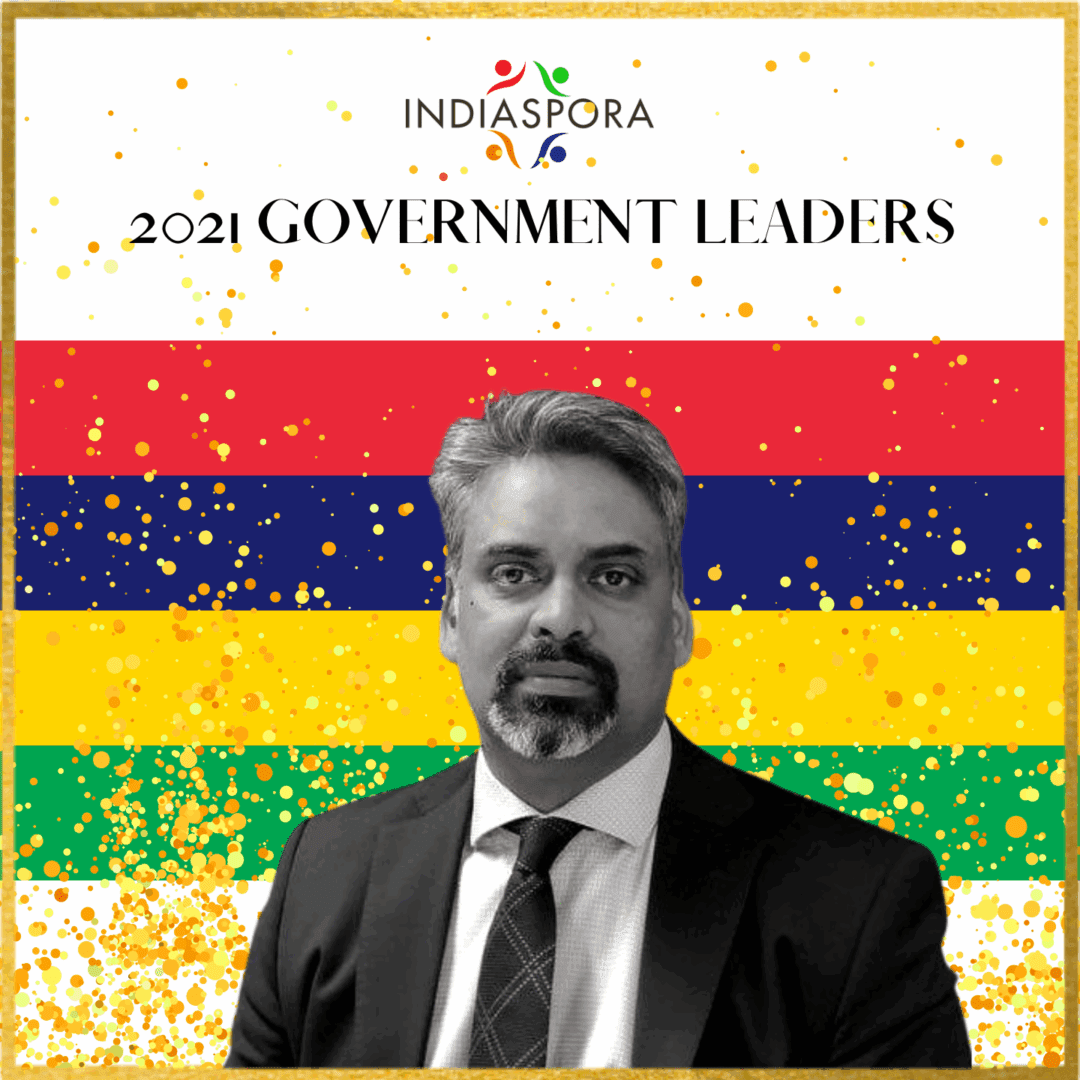 A man in suit and tie standing next to the words " government leaders ".