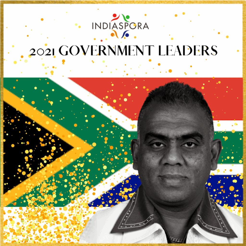 A man with a flag in the background.
