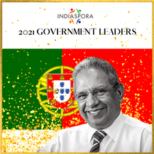A man in front of an image of portugal.