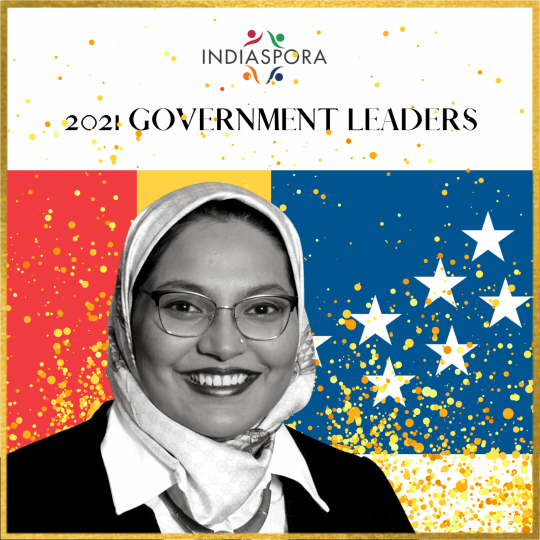 A woman in glasses and headscarf standing on top of a flag.|A woman in glasses and headscarf standing next to the words indiaspora 2 0 2 1 government leaders.