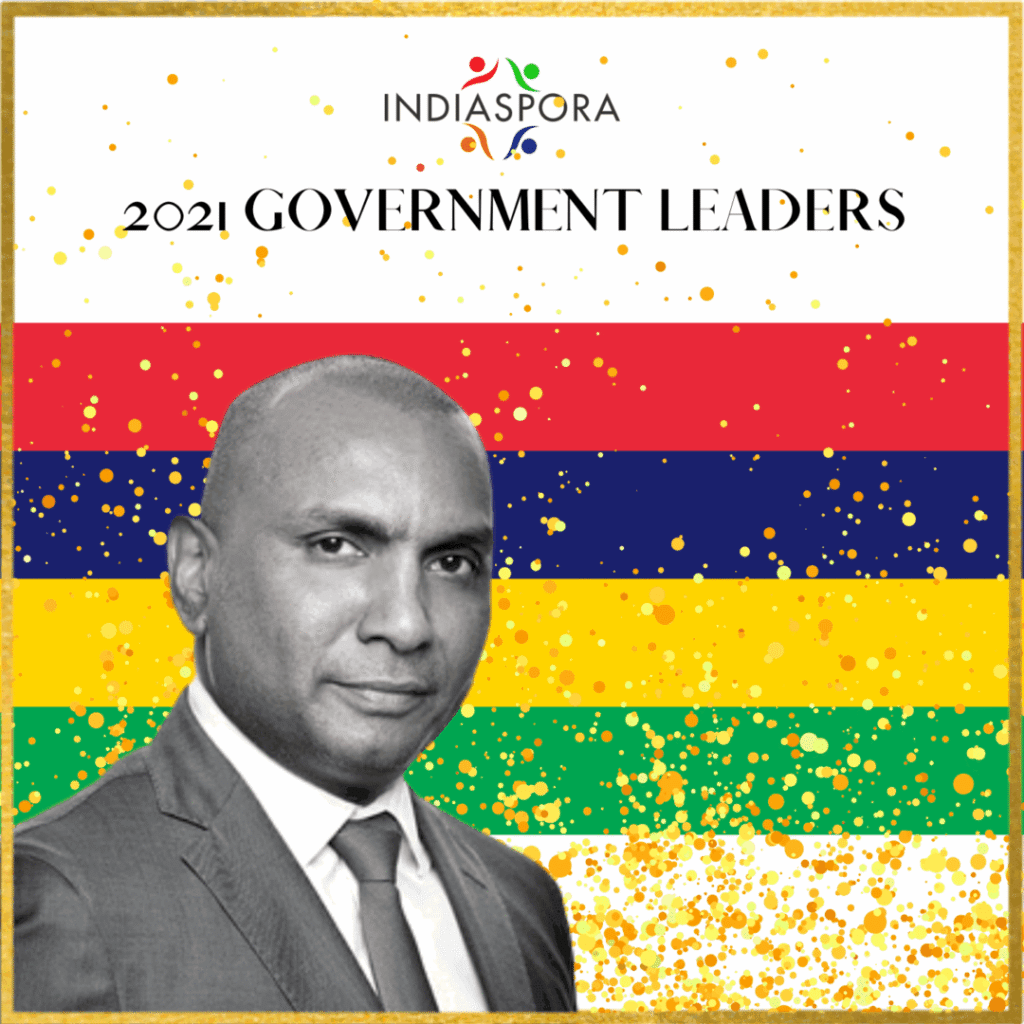 A man in suit and tie standing next to the words " government leaders ".