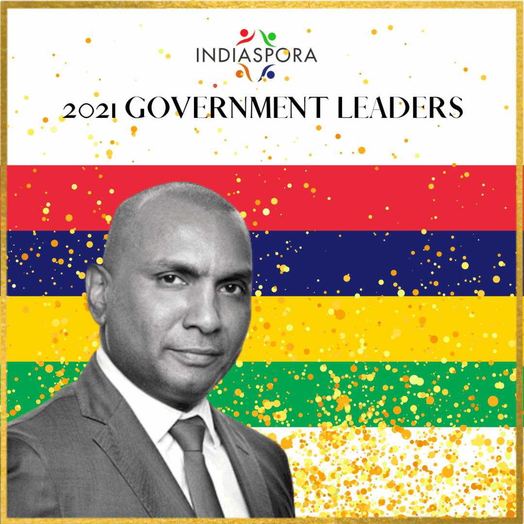 A man in suit and tie standing next to the words " government leaders ".